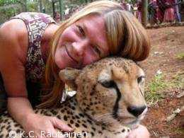K.C. snuggling a cheetah